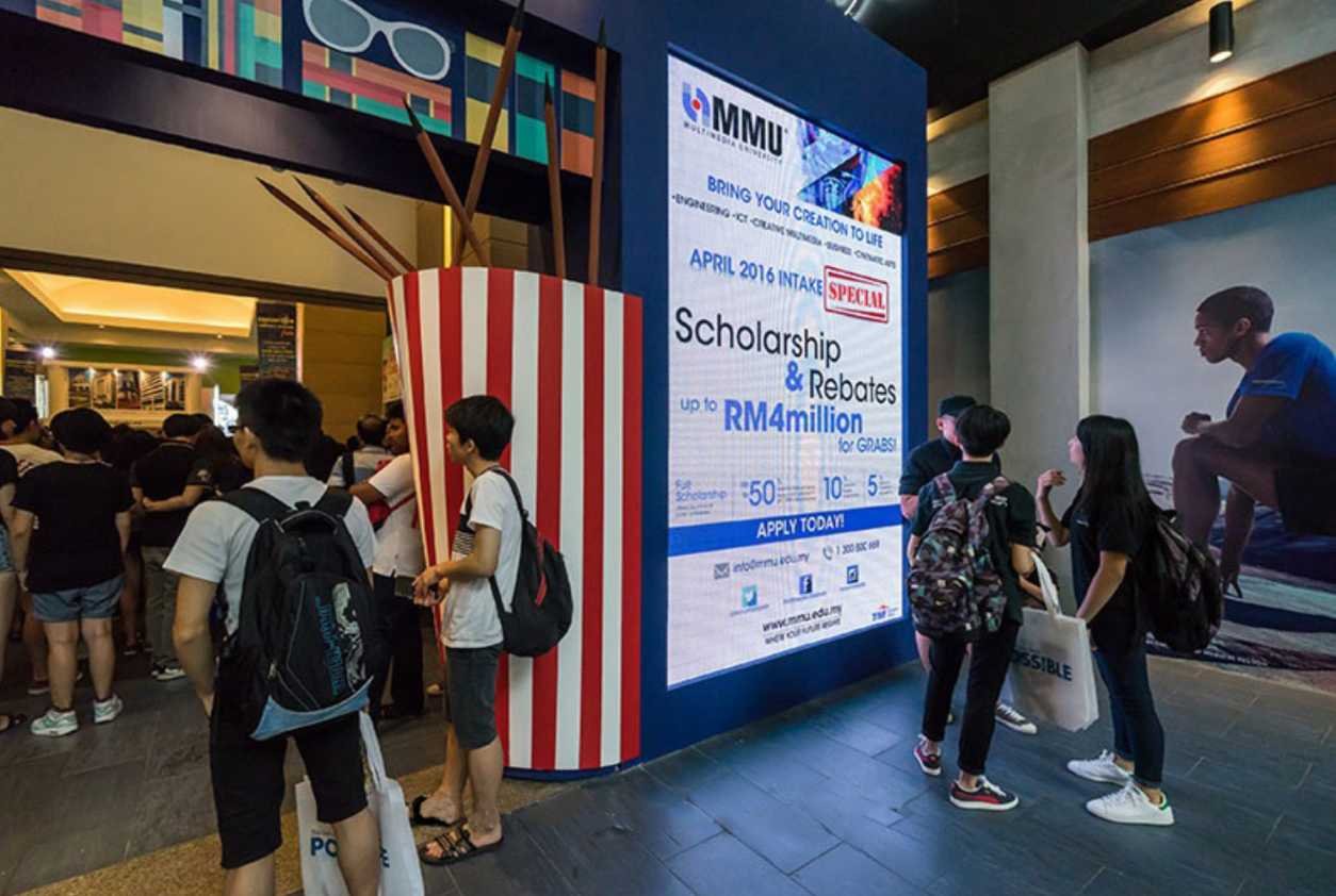 Engaged attendees viewing presentations on an LED screen rental, showcasing educational opportunities